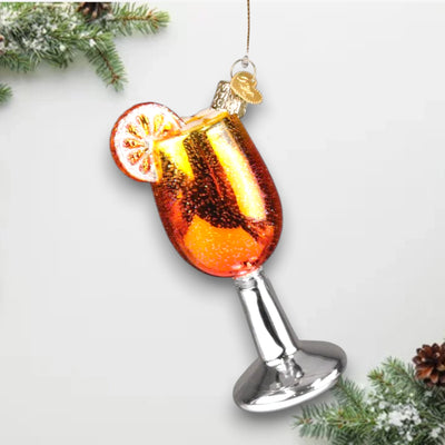 Personalized Aperol Spritz Christmas Ornament featuring a glittering orange cocktail with a slice of orange garnish and a sleek silver stem, customizable with name and year.