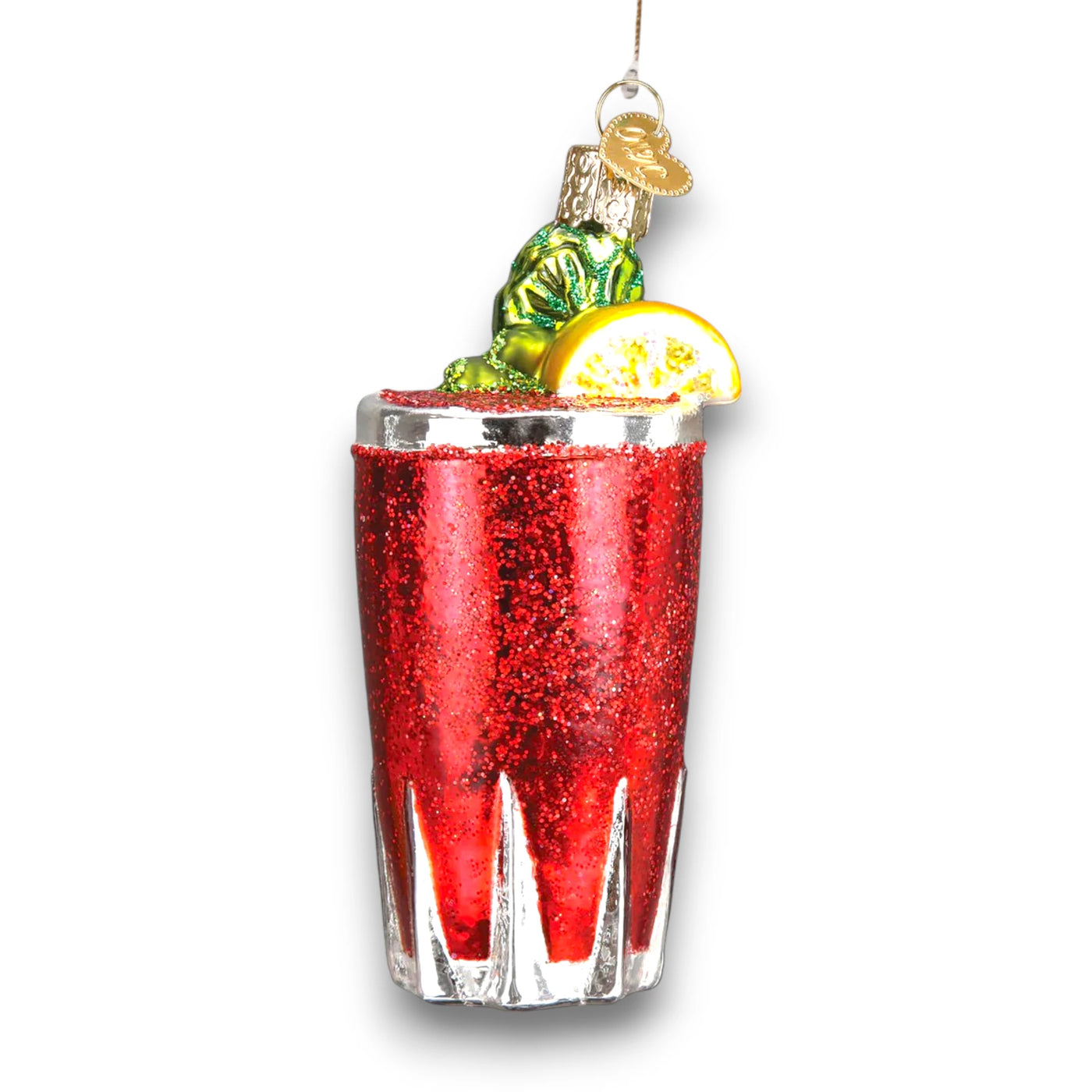 Bloody Mary Christmas ornament featuring a glittery red cocktail in a glass with celery garnish and a lemon slice, accented with shimmering details.