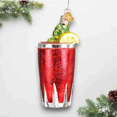 Bloody Mary Christmas ornament featuring a glittery red cocktail in a glass with celery garnish and a lemon slice, accented with shimmering details.