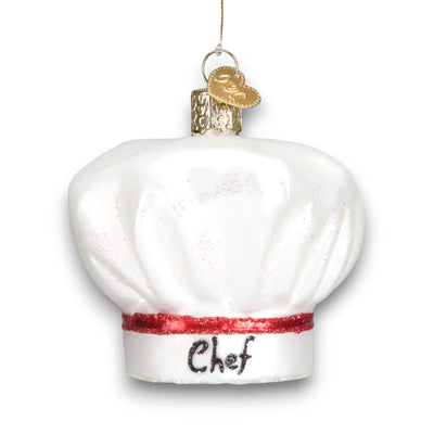 White chef’s hat Christmas ornament with a red glitter band and “Chef” written on the front, featuring elegant shimmering details.