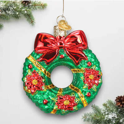 Personalized Christmas Wreath Ornament featuring a green wreath with glittered red poinsettias, gold accents, and a red bow, customizable with name and year.