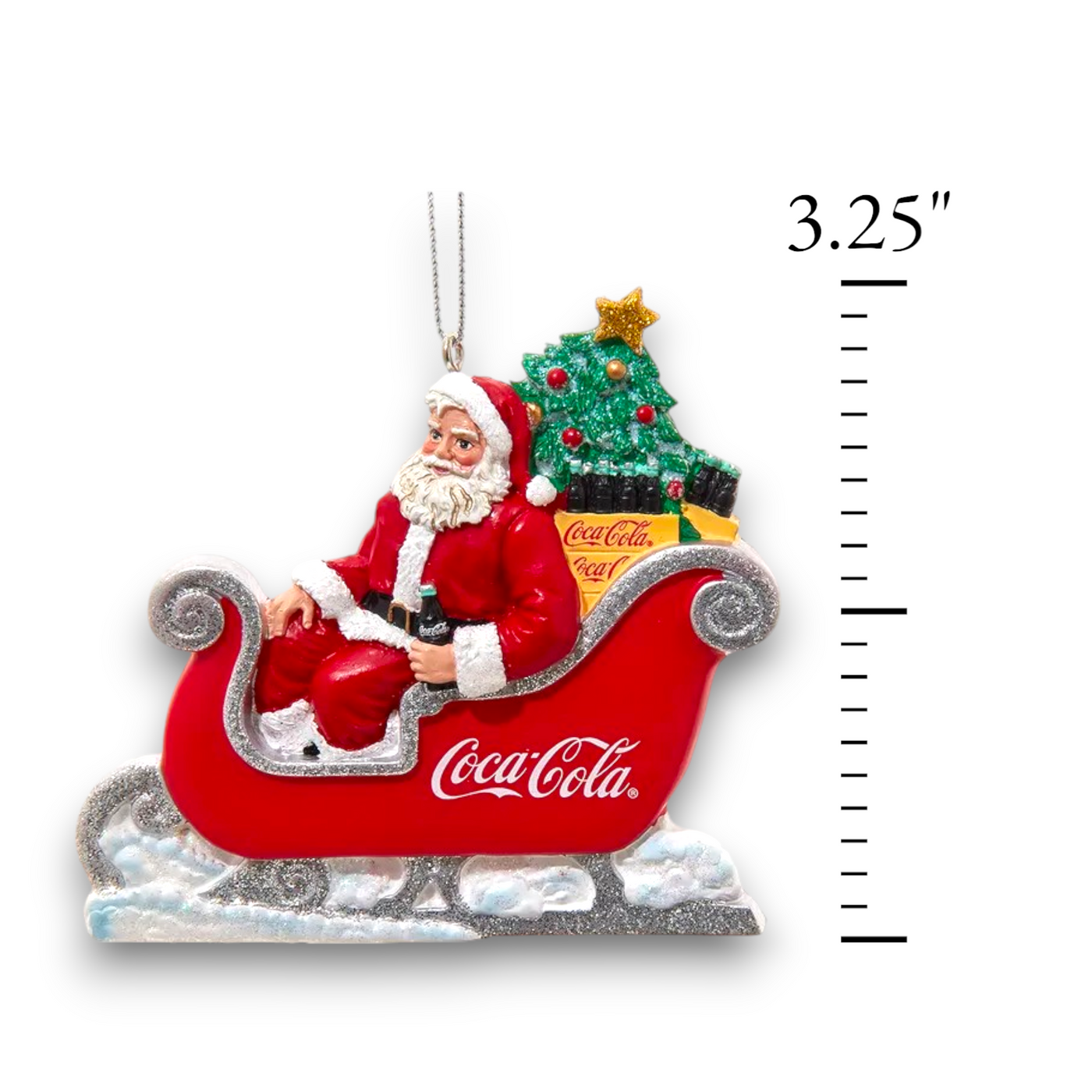 Coca-Cola Santa in Sleigh ornament hanging showing height of 3.25 inches with ruller, adding a nostalgic and festive holiday touch.