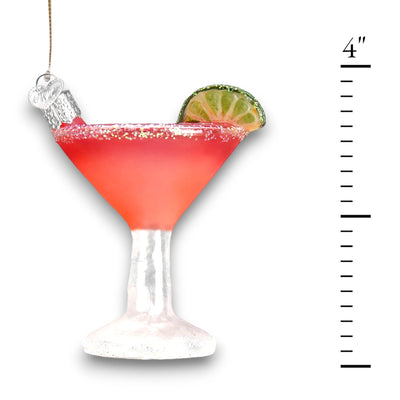 Cosmopolitan cocktail Christmas ornament featuring a vibrant pink drink, glittered sugared rim, and lime wedge garnish in a clear glass.