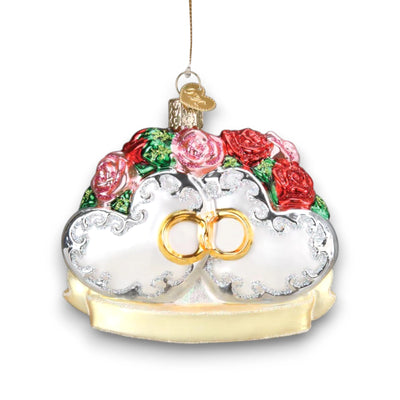 Couples First Christmas ornament featuring two hearts with red and pink roses, gold intertwined rings, and glitter accents, perfect for newlyweds.