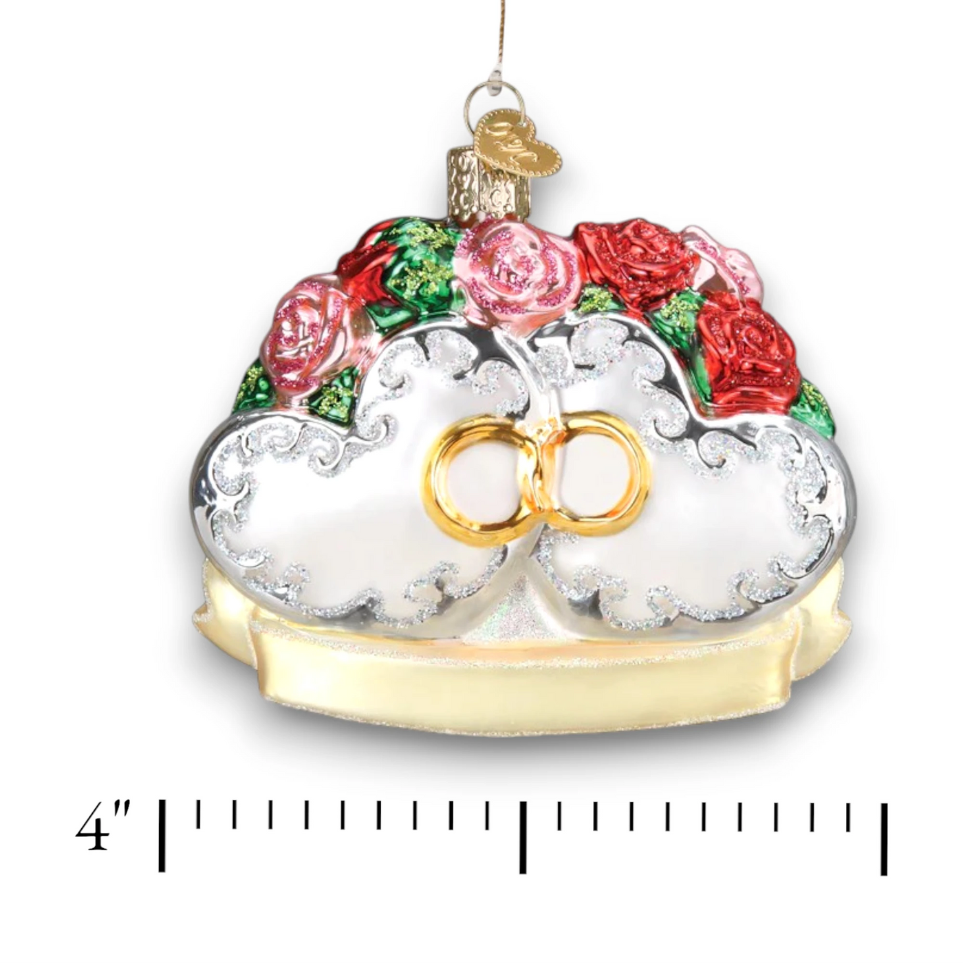 Couples First Christmas ornament featuring two hearts with red and pink roses, gold intertwined rings, and glitter accents, perfect for newlyweds.