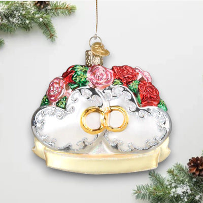 Couples First Christmas ornament featuring two hearts with red and pink roses, gold intertwined rings, and glitter accents, perfect for newlyweds.