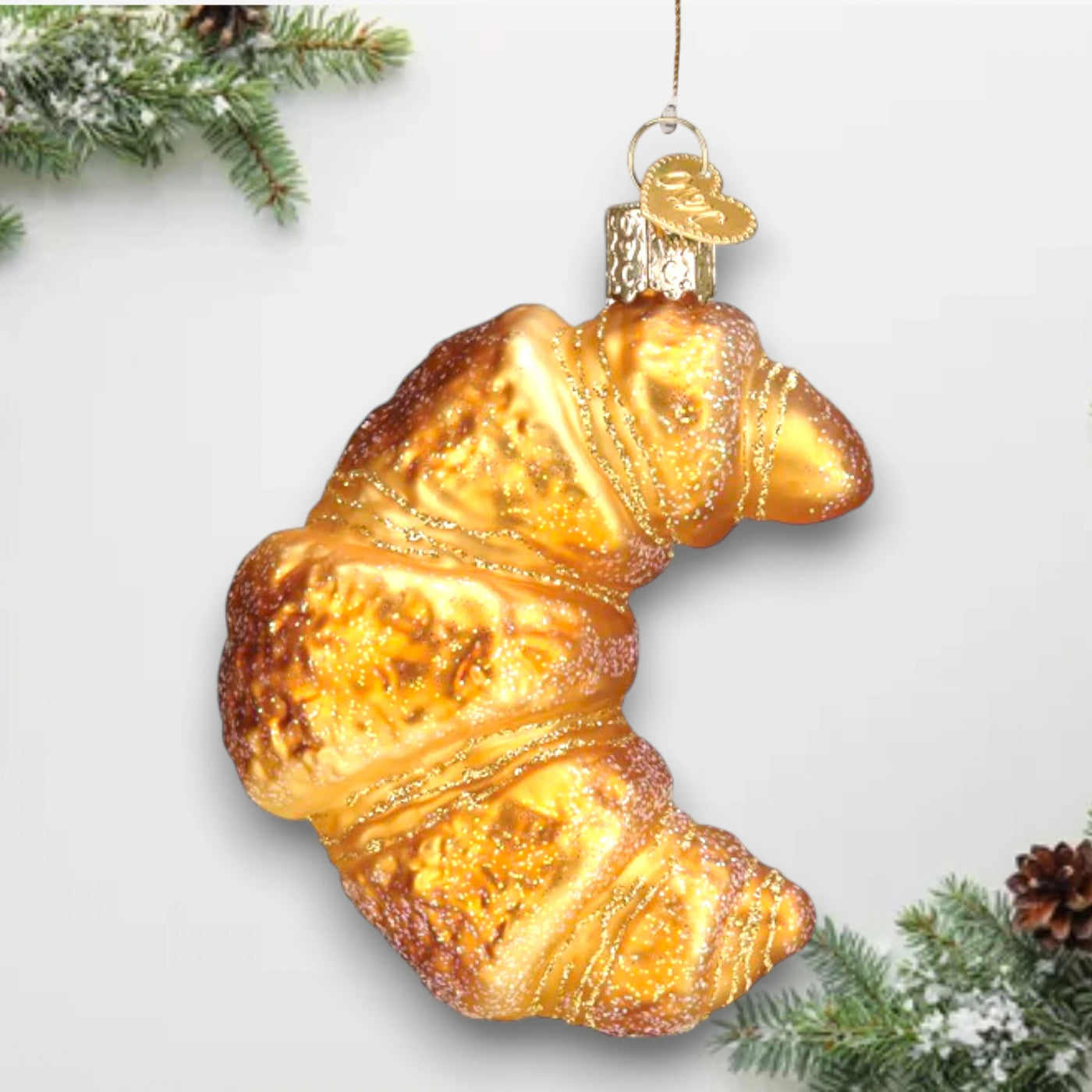 Personalized Croissant Christmas Ornament featuring a golden, flaky croissant with glittery accents, customizable with name and year.