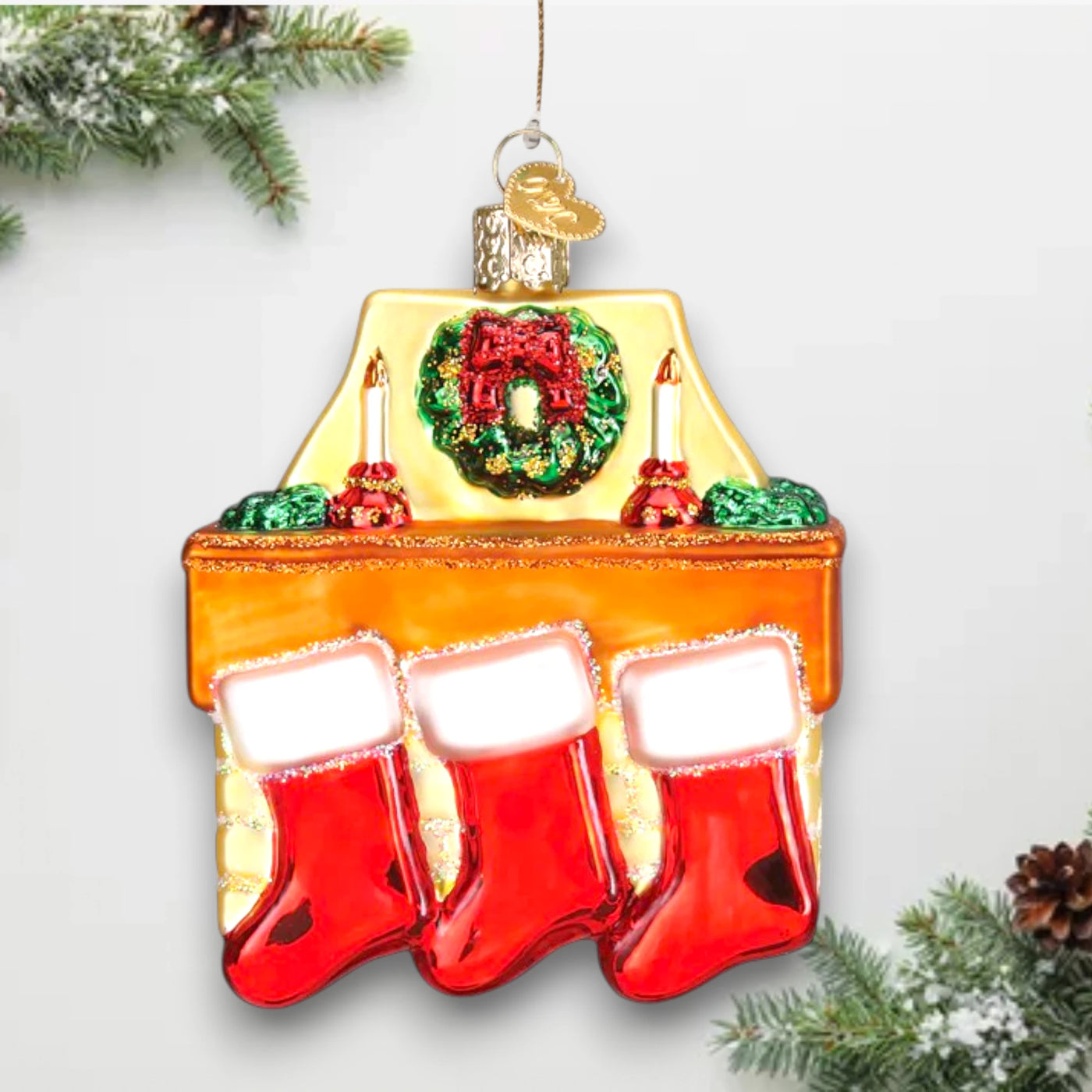 Family of 3 stockings Christmas ornament featuring a cozy fireplace with red stockings, candles, and a wreath, customizable with names and year.