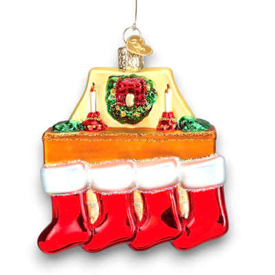 Family of 4 stockings Christmas ornament featuring a cozy fireplace with red stockings, candles, and a wreath, customizable with names and year.