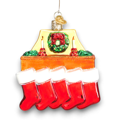 Family of 5 stockings Christmas ornament featuring a cozy fireplace with red stockings, candles, and a wreath, customizable with names and year.