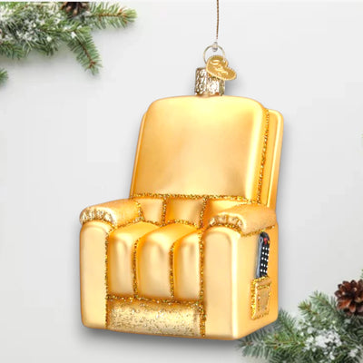 Golden recliner Christmas ornament with glitter accents and side pocket featuring a remote control, customizable with name and year.