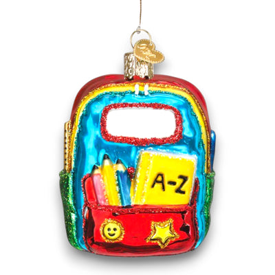 Personalized First Day Of School Christmas Ornament featuring a colorful backpack with school supplies, customizable with a name and year.