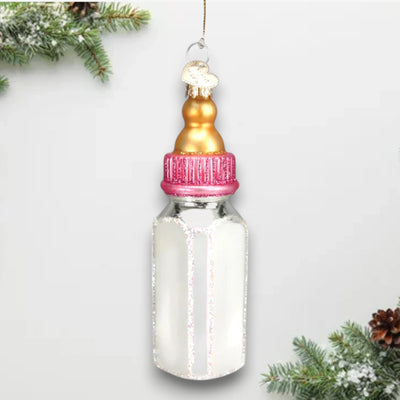 Personalized Girl Baby Bottle Christmas Ornament featuring a golden nipple, pink cap, and glitter accents, customizable with name and year.