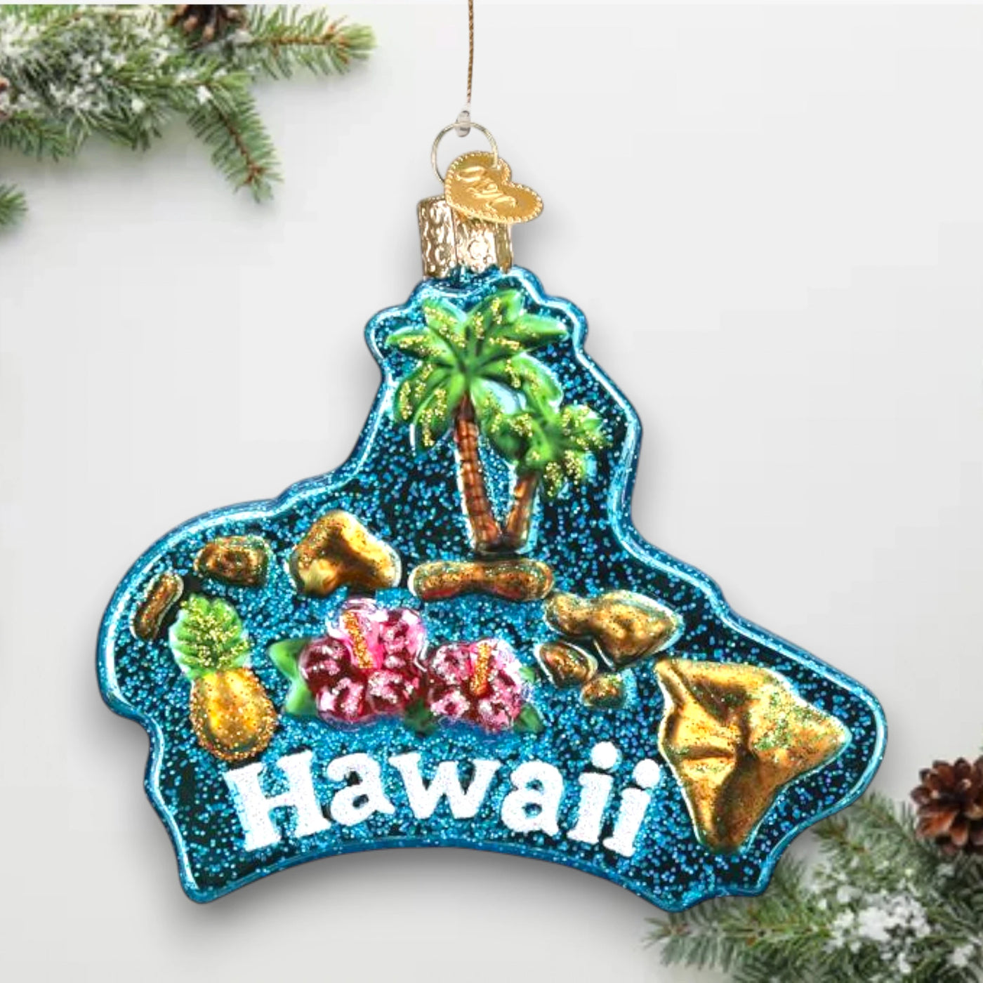 Personalized Hawaiian Islands Christmas Ornament featuring a glittered blue background with palm trees, hibiscus flowers, pineapples, and golden accents, customizable with name and year.