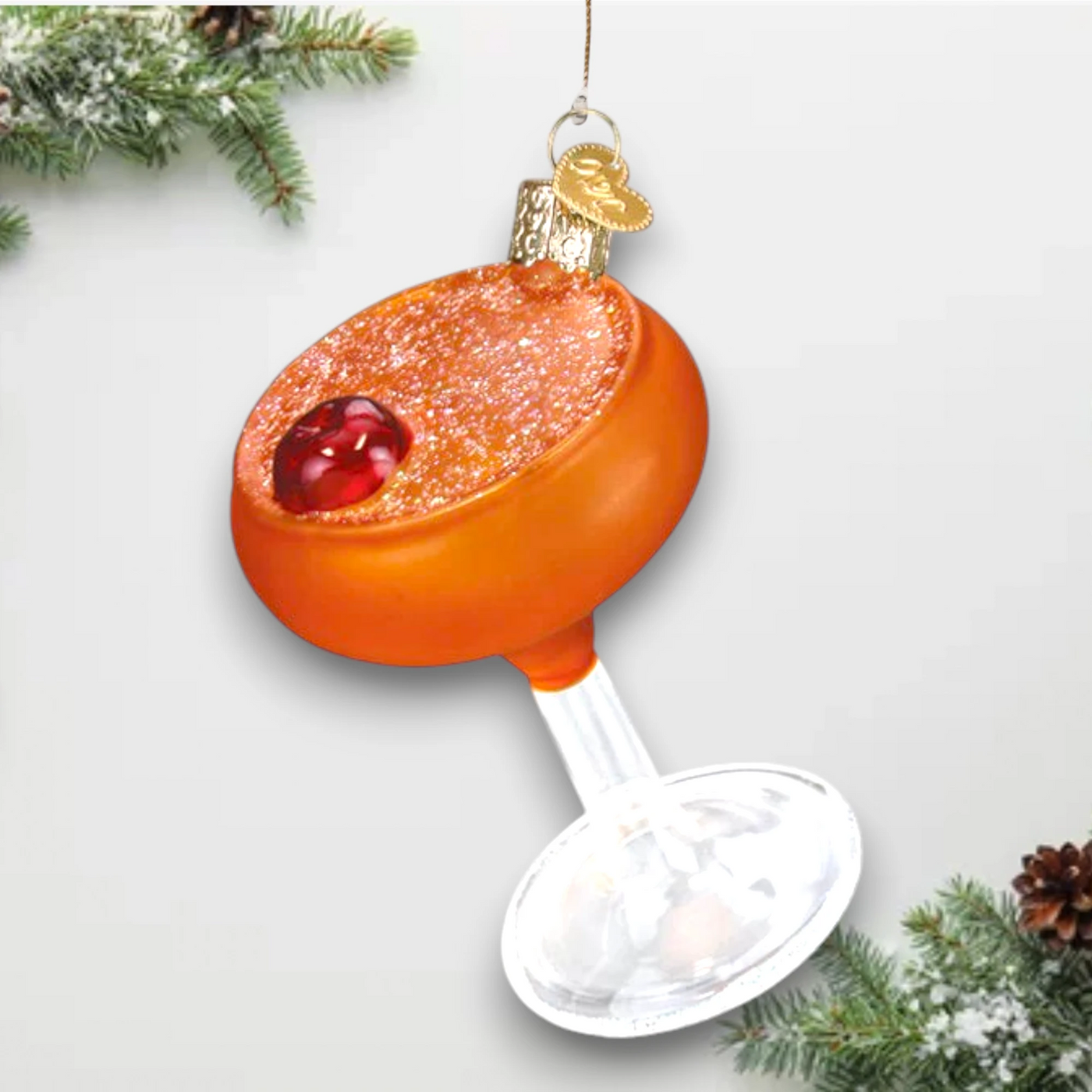 Personalized Manhattan Martini Christmas Ornament featuring an orange cocktail with a cherry garnish in a shimmering glass, customizable with name and year.