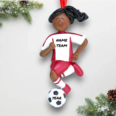 Personalized African American Female Soccer Ornament in Red Uniform, dribbling a ball. Customizable with name, team, and year.