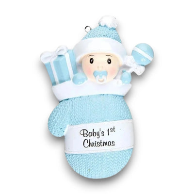 Personalized Baby Boy In Mitten Ornament with blue knit pattern, baby boy in winter hat and pacifier, customizable with name and year.