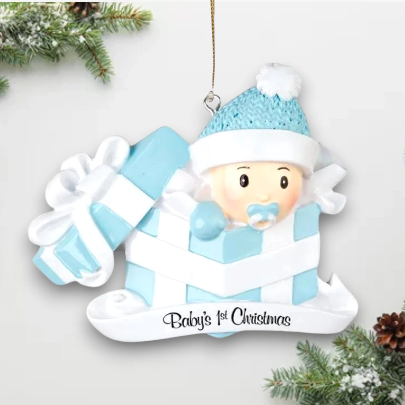 Personalized Baby Boy Christmas Ornament with baby in a blue present box, customizable with name and year.