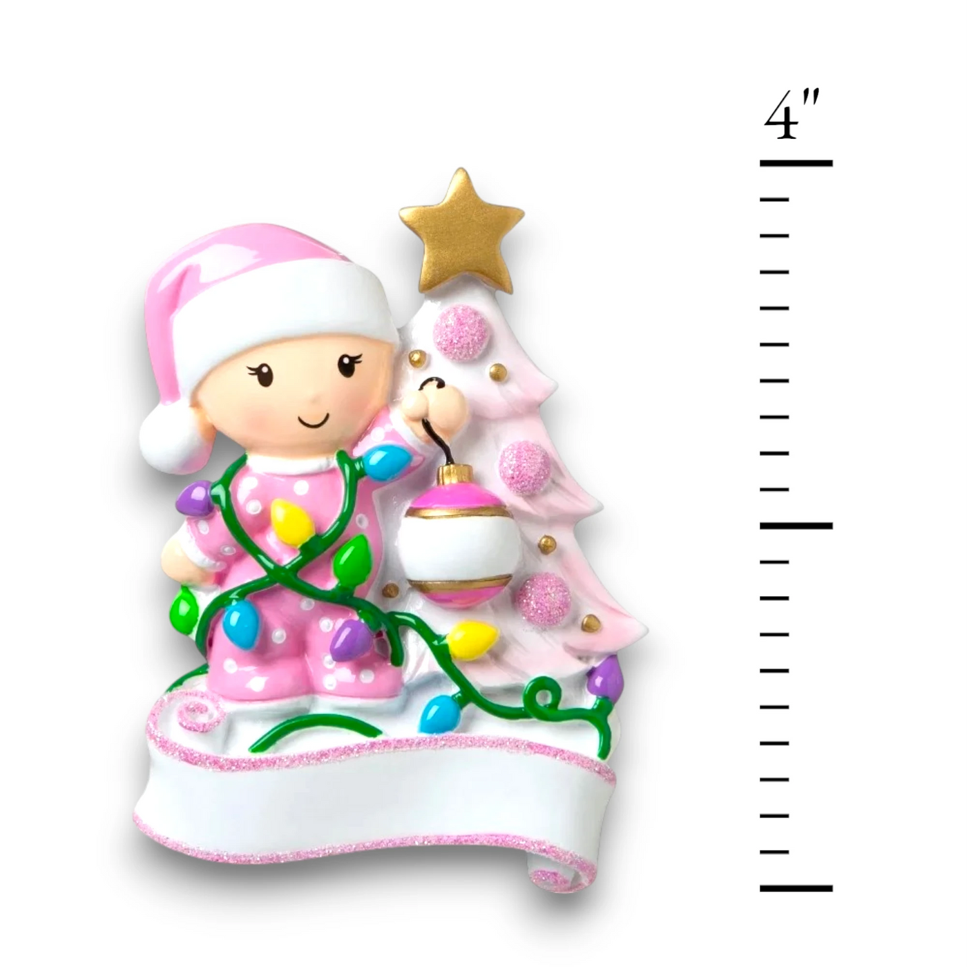 Personalized Baby Decorating A Tree Pink Christmas Ornament with customizable name and year, featuring a baby girl with holiday lights and a decorated Christmas tree.