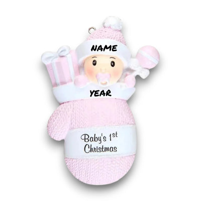 Personalized Baby Girl In Mitten Ornament with pink knit pattern, baby girl in winter hat and pacifier, customizable with name and year.