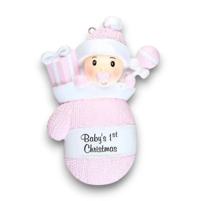 Personalized Baby Girl In Mitten Ornament with pink knit pattern, baby girl in winter hat and pacifier, customizable with name and year.