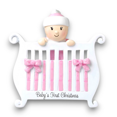 Personalized Baby Girl in Crib Christmas Ornament with customizable name and year, featuring a baby girl peeking over a crib with pink bows and glitter accents.