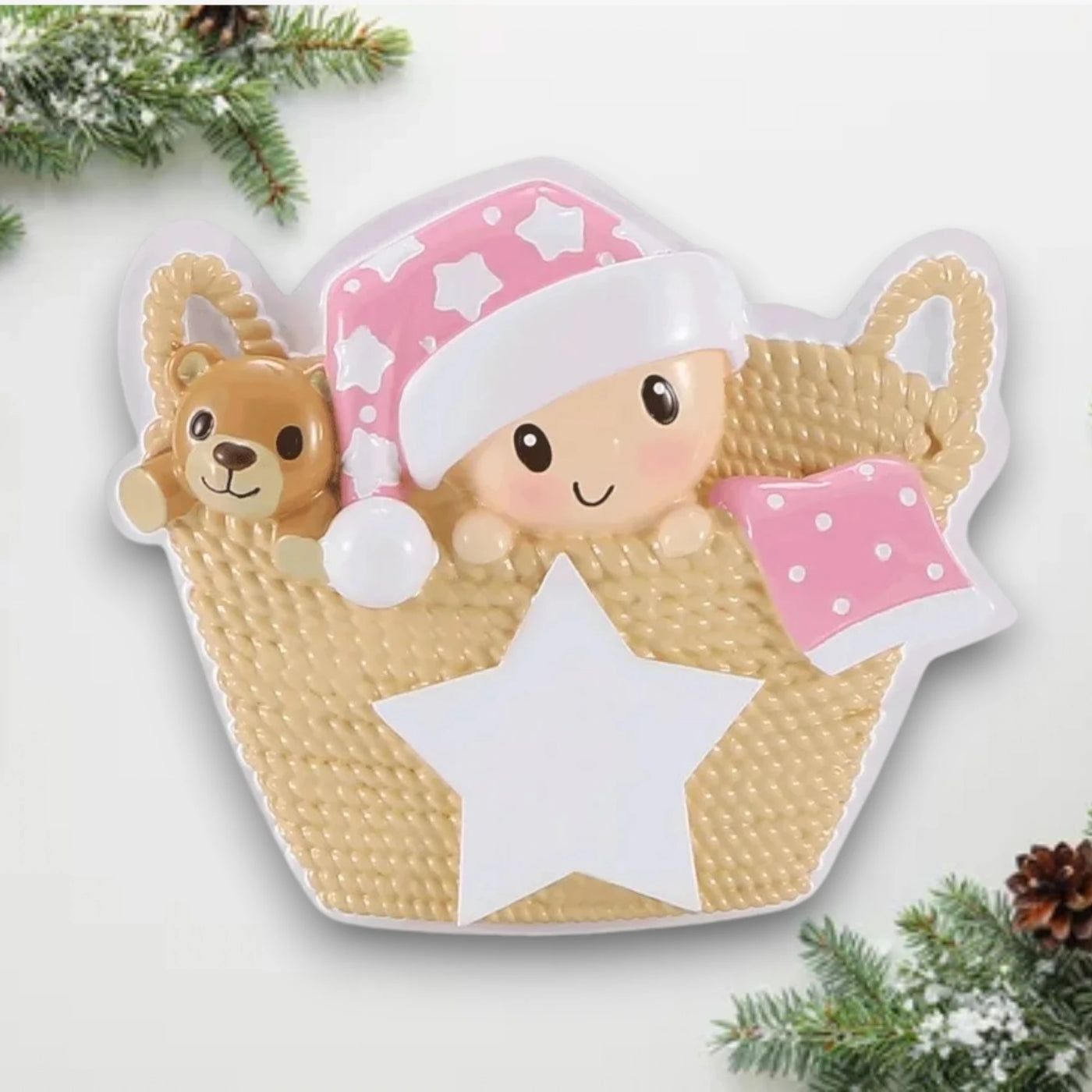 Personalized Baby in Basket Pink Christmas Ornament featuring a baby girl with a pink starry hat and teddy bear, customizable with name and year.