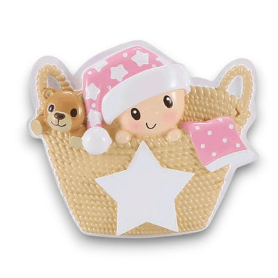 Personalized Baby in Basket Pink Christmas Ornament featuring a baby girl with a pink starry hat and teddy bear, customizable with name and year.