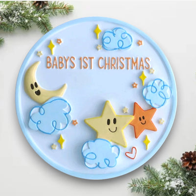  Personalized Baby’s 1st Christmas ornament featuring stars, clouds, and a crescent moon, customizable with name and year.