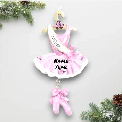 Personalized Ballet Christmas Ornament featuring a pink tutu, dangling ballet slippers, and customizable sash with name and year.