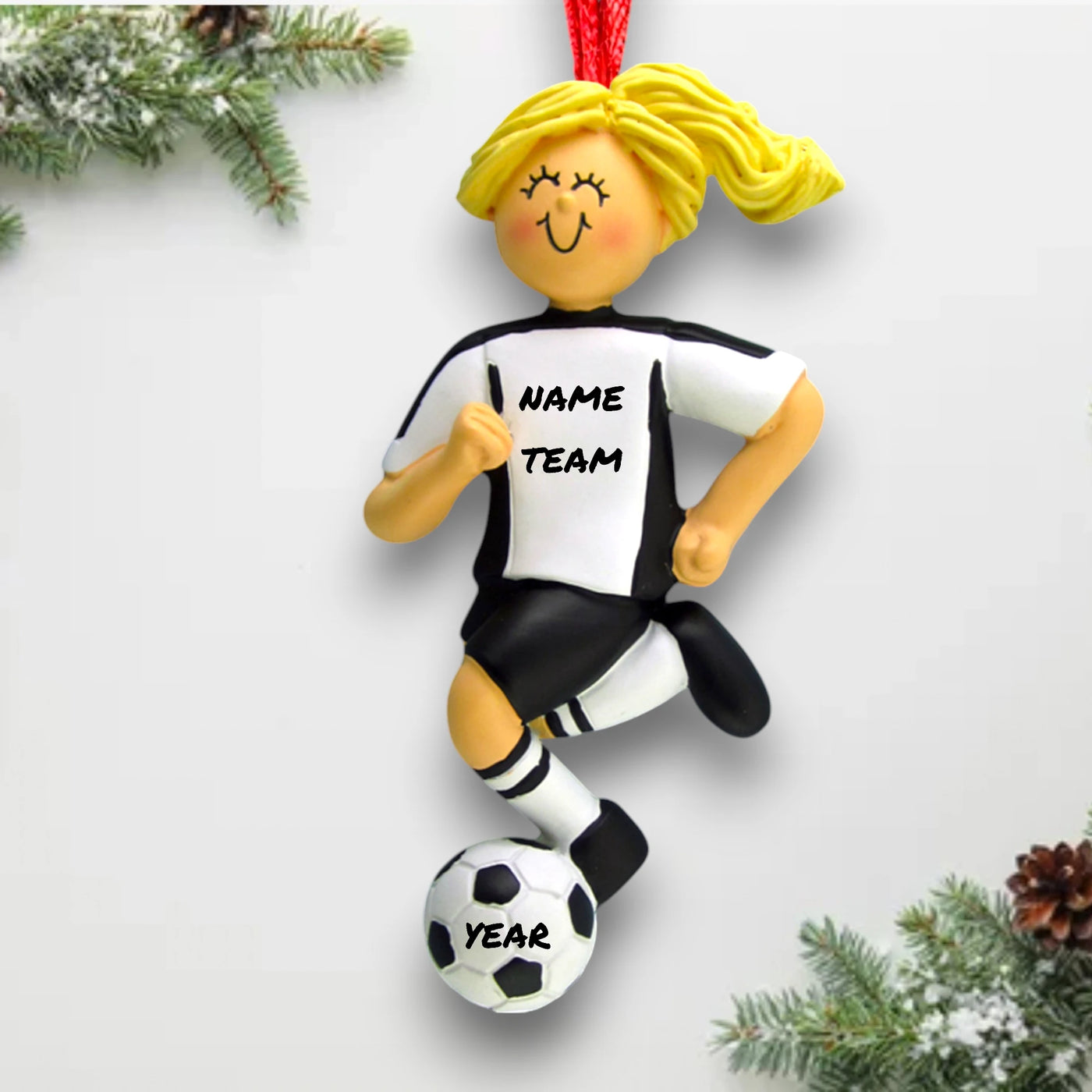 Personalized Blonde Female Soccer Ornament in White Uniform dribbling a soccer ball, customizable with name, team, and year.