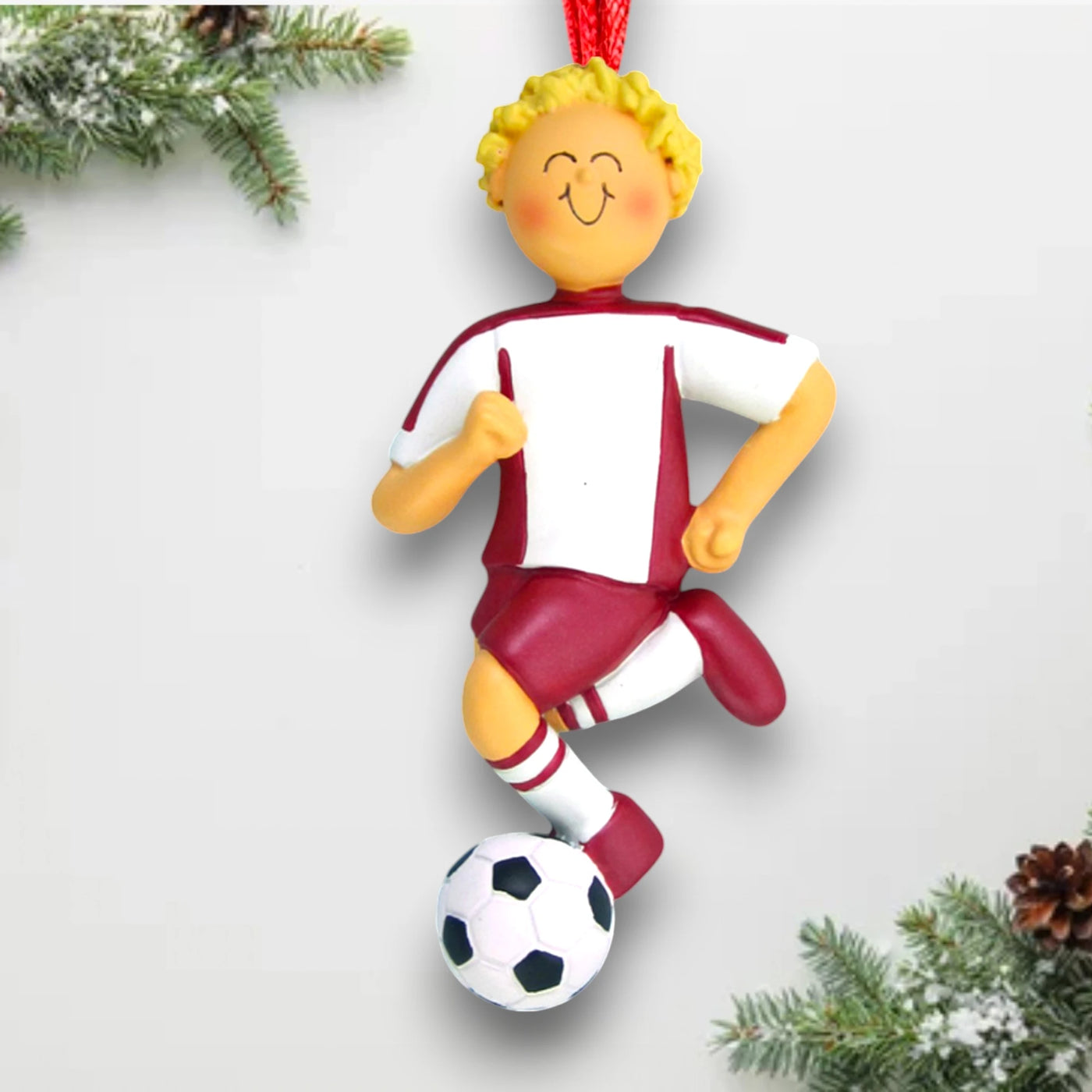 Personalized Blonde Male Soccer Ornament, wearing a red uniform and dribbling a soccer ball, customizable with name, team, and year.