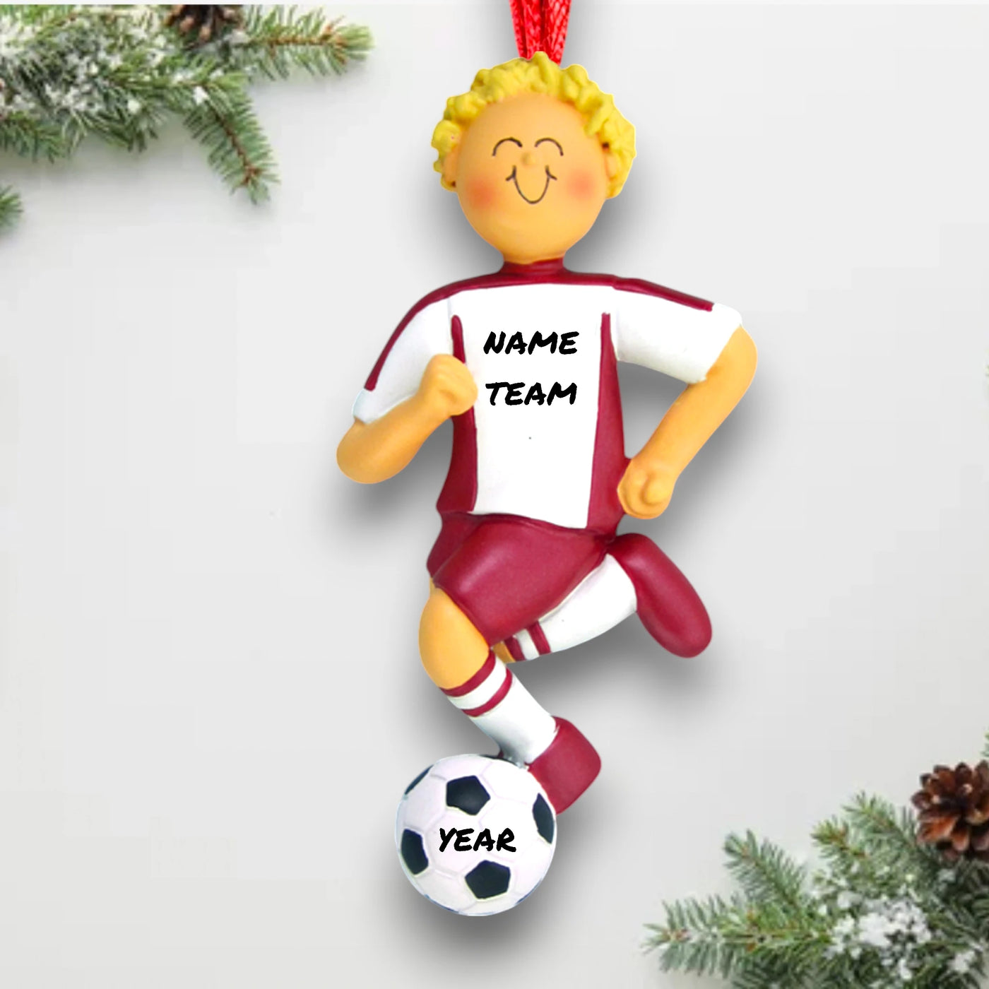 Personalized Blonde Male Soccer Ornament, wearing a red uniform and dribbling a soccer ball, customizable with name, team, and year.