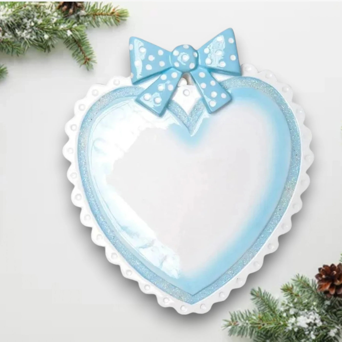 Personalized Blue Baby Heart Christmas Ornament with customizable name and year, adorned with a blue polka-dot bow.