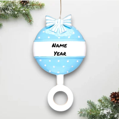 Personalized Blue Baby Rattle Christmas Ornament with customizable name and year, decorated with polka dots and a bow.