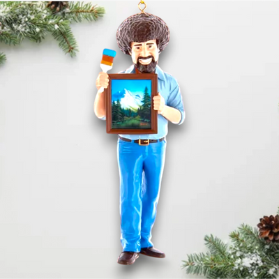 Personalized Bob Ross Christmas Ornament featuring Bob Ross holding a framed painting and palette, customizable with a name and year.
