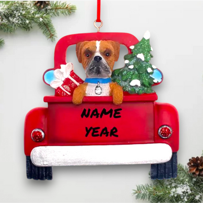 Personalized Boxer In Back Of Truck Christmas Ornament featuring a Boxer, festive Christmas tree, and holiday gifts in a red truck with customizable name and year.

