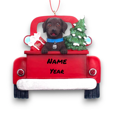 Personalized Brown Labrador In Back Of Truck Christmas Ornament featuring a Brown Labrador, festive Christmas tree, and holiday gifts in a red truck with customizable name and year.