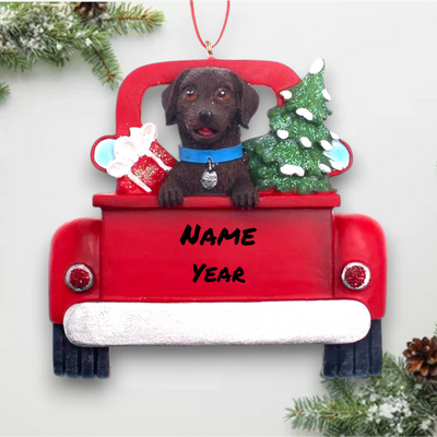 Personalized Brown Labrador In Back Of Truck Christmas Ornament featuring a Brown Labrador, festive Christmas tree, and holiday gifts in a red truck with customizable name and year.