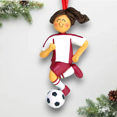 Personalized Brunette Female Dribbling Soccer Ornament in Red Uniform, customizable with name, team, and year.