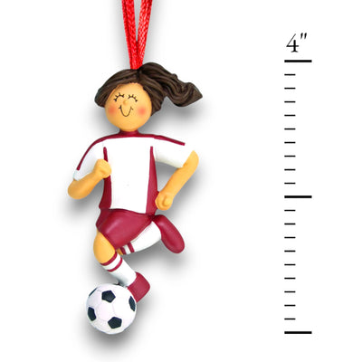 Personalized Brunette Female Dribbling Soccer Ornament in Red Uniform, customizable with name, team, and year.