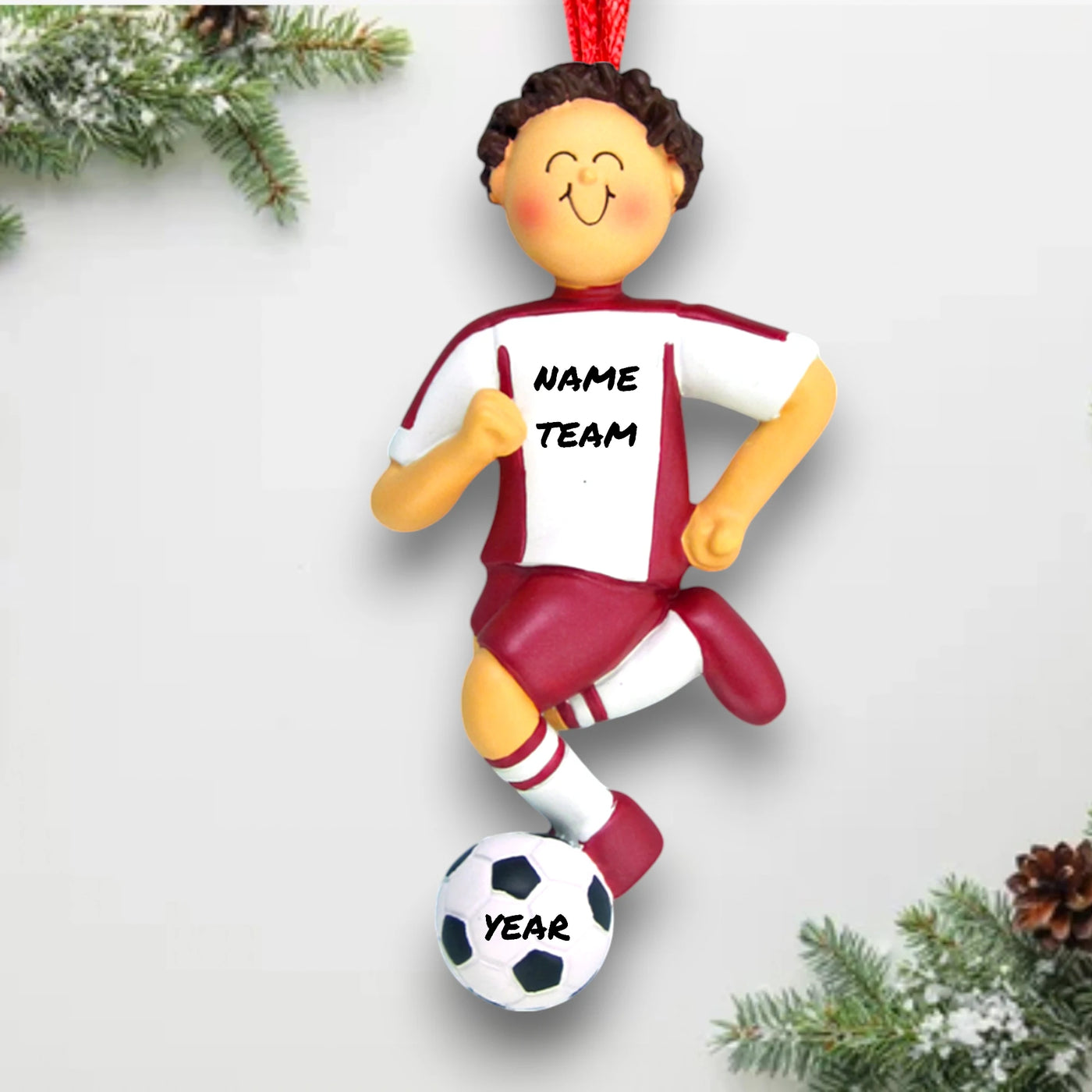 Personalized Brunette Male Soccer Ornament with Red Uniform, dribbling a soccer ball, customizable with name and year.