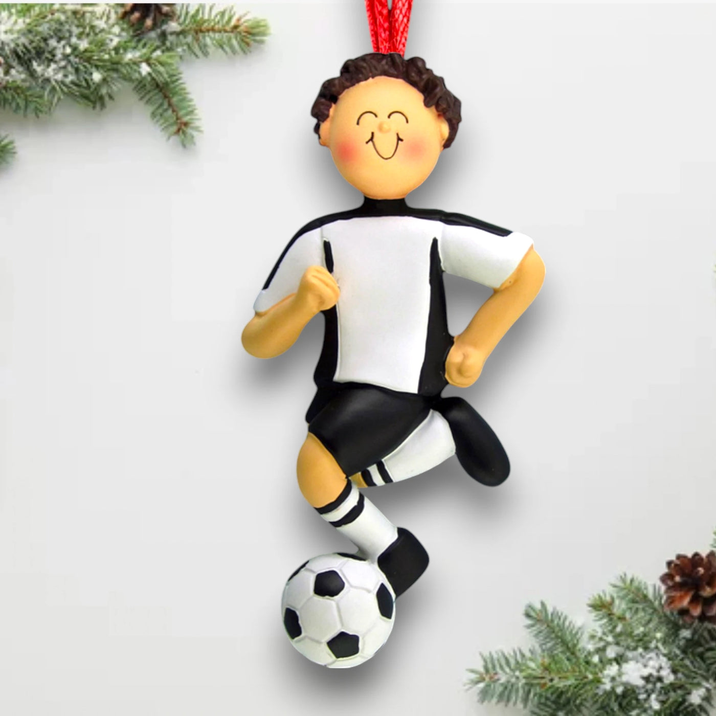 Personalized Soccer Ornament with a brunette male in a white uniform, dribbling a soccer ball, customizable with name, team, and year.