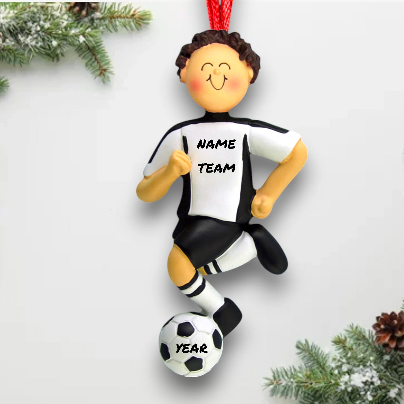 Personalized Soccer Ornament with a brunette male in a white uniform, dribbling a soccer ball, customizable with name, team, and year.