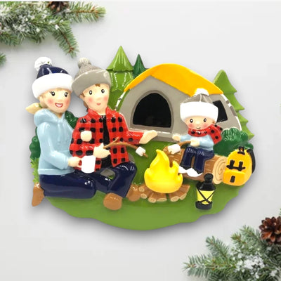  Personalized family of 3 camping ornament with family members around a campfire and tent, customizable with names and year.
