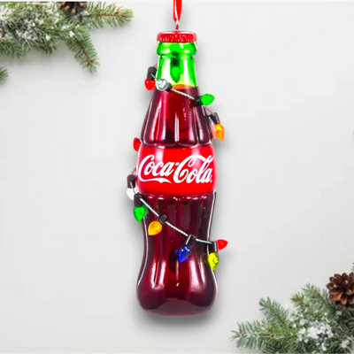 Personalized Coke Bottle With Light String Christmas Ornament featuring a classic Coca-Cola bottle wrapped in colorful Christmas lights.
