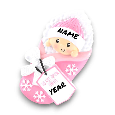 Personalized Do Not Open Until Pink Christmas Ornament with customizable name and year, featuring a baby girl in a cozy pink blanket with snowflake details.