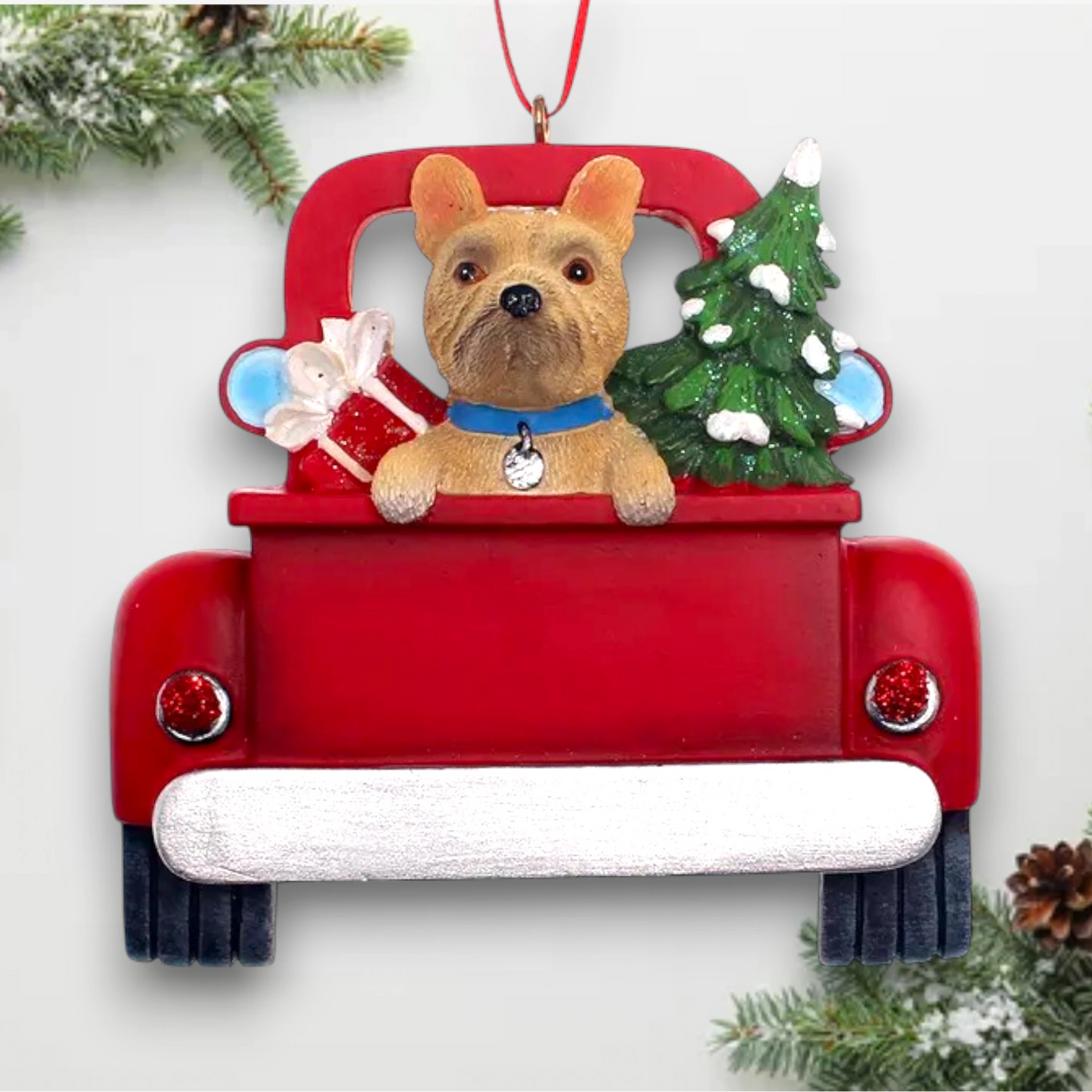 Personalized French Bulldog In Back Of Truck Christmas Ornament featuring a French Bulldog, Christmas tree, and holiday presents in a red truck with customizable name and year.