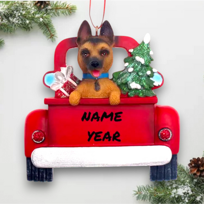 Personalized German Shepherd In Back Of Truck Christmas Ornament featuring a German Shepherd, Christmas tree, and holiday presents in a festive red truck with customizable name and year.

