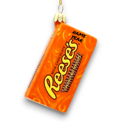 Personalized Glass Reese's Chocolate Christmas Ornament resembling the iconic orange wrapper with bold lettering.

